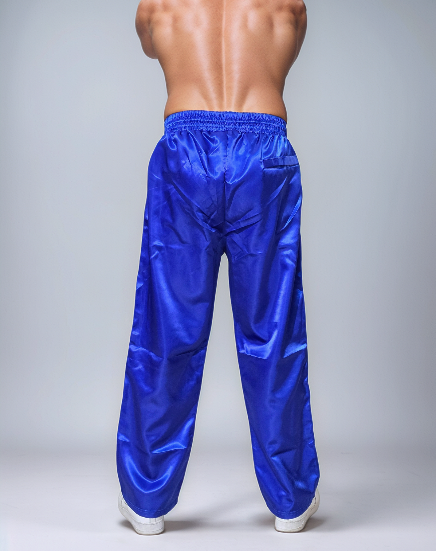 Glänzende schwarz-rote sportliche Jogginghose aus PU-Nylon - Unisex Activewear